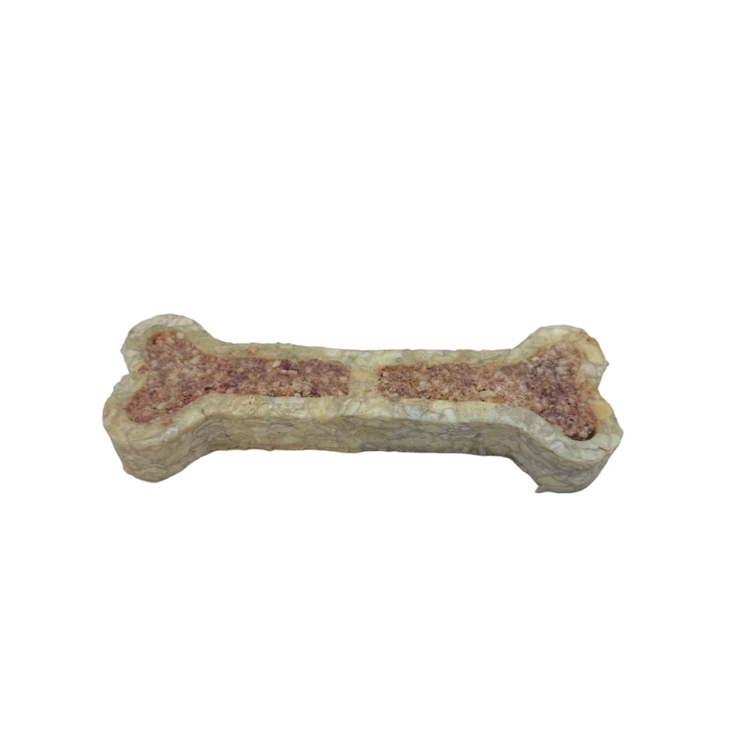 Dog bone-shaped treat on a white background