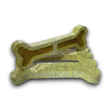 Load image into Gallery viewer, A bone-shaped dog treat holder or stand made of textured, light yellow-green material with a hollow center, shown on a plain white background.
