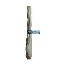 Load image into Gallery viewer, A single natural dog chew bone, lAnco Naturals Giant Goat Roll, with a dark blue and white paper band around the middle reading 'ANCO NATURALS DEER LEG BONE'. The product is photographed vertically against a solid white background.
