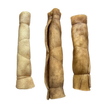 Load image into Gallery viewer, Three rolled-up Anco Naturals Goat Rolls Medium on a white background
