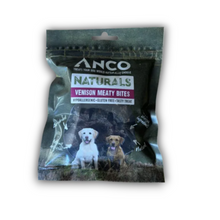 Load image into Gallery viewer, ANCO Naturals Venison Meaty Bites dog treat pouch, featuring a resealable dark green and black package with a clear window showing two dogs, on a white background.
