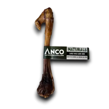Load image into Gallery viewer, Anco Naturals Large Wild Game Bone dog chew, featuring a realistic brown bone-shaped treat with a black and white paper label
