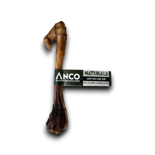 Load image into Gallery viewer, A natural dog bone chew with a black and white Anco Naturals label wrapped around the middle, shown on a white background with a soft drop shadow.
