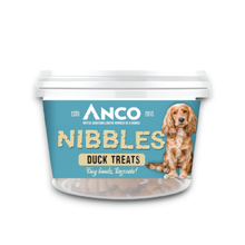 Load image into Gallery viewer, A tub of Anco Nibbles Duck Treats for dogs, featuring a light blue label with a brown Cocker Spaniel illustration and the brand name 'ANCO' in white.
