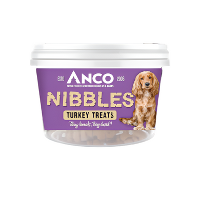 Dog treat container labeled 'Anco Nibbles Turkey Treats' with a purple label and white lid.
