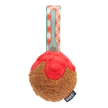 Load image into Gallery viewer, A plush dog toy shaped like a slice of pizza or bread with red topping and a woven strap featuring a fork design, shown on a plain white background.
