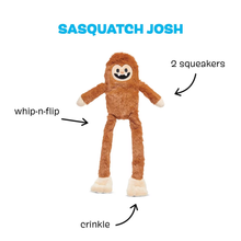 Load image into Gallery viewer, A brown plush toy figure labeled 'SASQUATCH JOSH' on a white background, with callout arrows and text pointing out features: 'whip-n-flip', '2 squeakers', and 'crinkle'.
