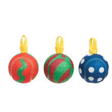 Load image into Gallery viewer, Three Christmas ornament balls made from recycled tennis balls, featuring red and green patterns on the left two and blue with white polka dots on the right, each with a yellow hanging loop, set against a plain white background.
