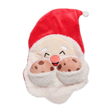 Load image into Gallery viewer, A plush Santa Claus face headrest pillow featuring a red velvet hat, white faux-fur beard, embroidered smiling face, and brown polka-dot pockets, isolated on a white background.
