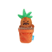 Load image into Gallery viewer, A plush dog toy shaped like a grumpy cartoon carrot or acorn sitting in an orange pot, with green knitted leaf-like spikes on top. A small blue tag reading 'LARKS' is visible on the side, set against a plain white background.
