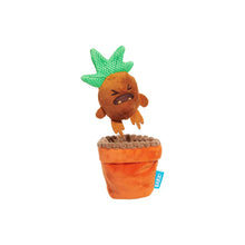Load image into Gallery viewer, A plush dog toy shaped like a frustrated orange plant in an orange pot, with a green knitted leafy top and a small blue tag reading BARKS, shown on a plain white background.
