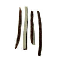 Load image into Gallery viewer, Four pieces of dried beef jerky on a white background
