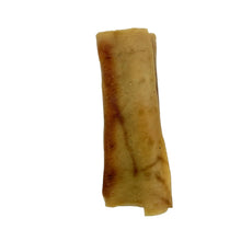 Load image into Gallery viewer, A single rolled, golden-brown pastry or crepe with dark brown toasted spots, photographed on a plain white background.

