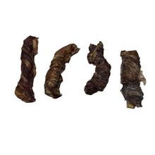 Load image into Gallery viewer, Dried or aged pieces of a Biltong Wrapped Buffalo Tail on a white surface

