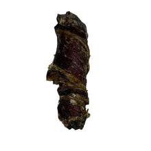 Load image into Gallery viewer, Biltong Wrapped Buffalo Tail on a white surface
