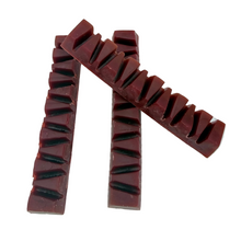 Load image into Gallery viewer, Red chewy candy with a textured surface on a white background
