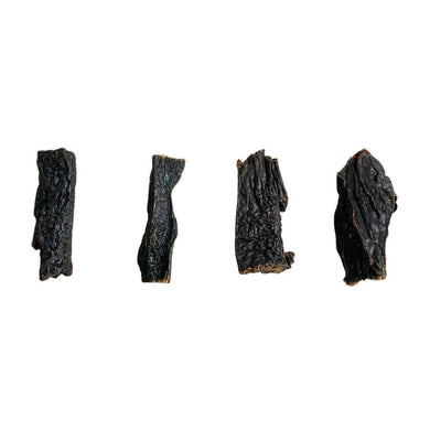 Three pieces of Nova Buffalo Liver treats for dogs, displayed against a white background. The treats are in a state of preservation and have a dark, textured appearance.