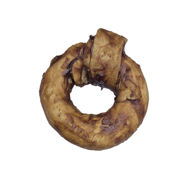 Brown Buffalo Collagen Ring on a white surface with a gloved hand in the background