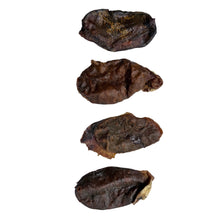 Load image into Gallery viewer, Four dark brown  Bully Danglers Beef Testicle on a white paper with circular patterns.
