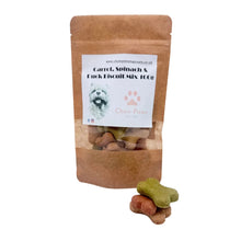 Load image into Gallery viewer, A stand-up kraft paper pouch labeled 'Chow Paws' dog biscuit mix, with a clear window showing the treats inside and three shaped treats placed in front on a white surface.
