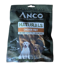 Load image into Gallery viewer, Anco Naturals Chicken Feet dog treat package with two dogs on a grassy background
