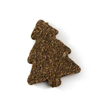 Load image into Gallery viewer, A single dog treat shaped like a small Christmas tree, made of textured brown kibble or dried food particles, photographed on a clean white background with a soft drop shadow.

