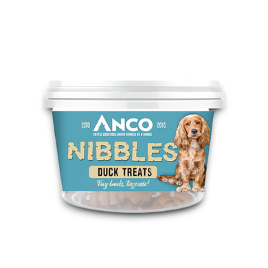 Anco Nibbles Duck Treats container with a dog on the label against a white background