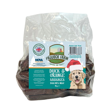 Bag of Paddock Farm duck and orange sausages for dogs with a visible label.