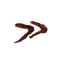 Load image into Gallery viewer, Two dried duck wings on a white background

