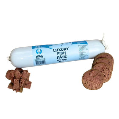 A tube of Nova Luxury Fish Pate alongside several cubes of the pate placed on a white surface.