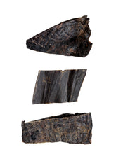 Load image into Gallery viewer, Three pieces of dark buffalo spleen pieces on a white paper background
