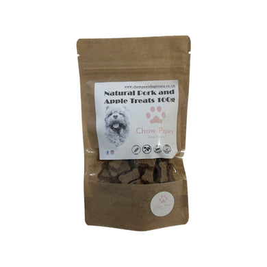 Bag of natural pork and apple treats for dogs with a visible label on a white background