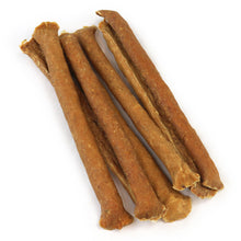 Load image into Gallery viewer, JR Pure Chicken Sticks on a white background, showing their flattened shape, textured surface and uneven ends.
