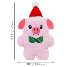 Load image into Gallery viewer, A pink plush pig toy wearing a red Santa hat and green bow tie, shown on a white background with dimension arrows and text indicating 15.75 inches tall by 10 inches wide.
