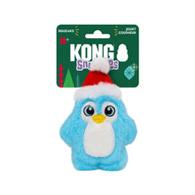 Load image into Gallery viewer, A blue plush penguin dog toy with a white belly, yellow beak, and a red Santa hat, attached to a green KONG Squeaks retail card on a white background.

