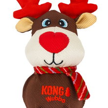 Load image into Gallery viewer, A plush dog toy shaped like a reindeer, with red fabric antlers, a cream-colored snout and ears, blue embroidered eyes, a red nose, and a red-and-green striped scarf. The toy is brown and has the text 'KONG Wubba' embroidered on the front, set against a plain white background.
