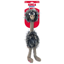 Load image into Gallery viewer, Kong Comfort Ostrich plush dog toy on its original retail packaging, featuring a gray and black shaggy body, a beige neck and legs, and a red and white header card.

