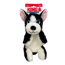 Load image into Gallery viewer, Kong Comfort dog toy plush dog in a black and white Boston Terrier style, with pink inner ears, blue eyes, and a red hanging retail header card.
