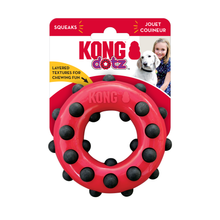 Load image into Gallery viewer, Kong Doz squeaky ring dog toy in red with black textured balls, shown on its original retail packaging card against a white background.
