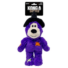 Load image into Gallery viewer, A purple plush dog toy shaped like a cartoon character, wearing a black witch hat and featuring orange and white Halloween accents, attached to a black Kong Kuttles retail header card on a white background.

