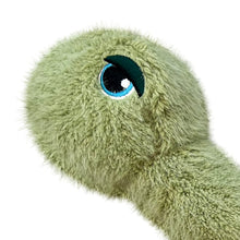 Load image into Gallery viewer, Close-up of a plush turtle toy head in light olive green with a large embroidered eye featuring blue, black, and white details, on a plain white background.
