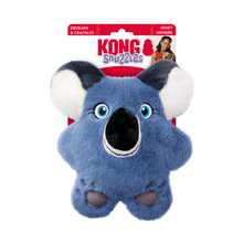 Load image into Gallery viewer, Kong Snuggles blue koala plush dog toy in its original retail packaging, featuring a blue plush body, white and dark gray ears, and a black snout.

