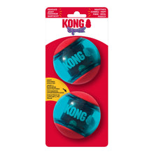Load image into Gallery viewer, KONG Squeez dog toy in its retail packaging, featuring two translucent teal-blue squeeze balls with red ends on a red backing card.

