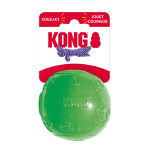 Load image into Gallery viewer, Kong Squeezz dog toy, a green textured rubber ball, attached to its original white and red cardboard packaging header card against a plain white background.
