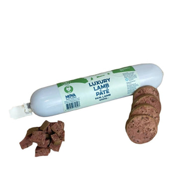 A tube of Nova Luxury Lamb Pate alongside scattered pieces of the pate, indicating it is a soft, possibly meaty texture.