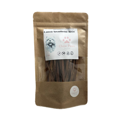 Brown package of dog treats with a label on a white background