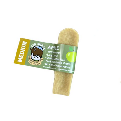 A packaged yak snack with apple flavor for dogs, labeled as medium size, with visible apple pieces.