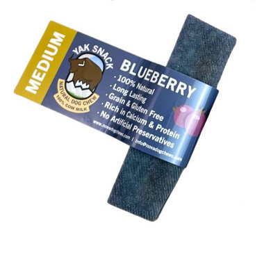 Packaging of Nova Yak Snack Blueberry Medium, highlighting its features such as being 100% natural, long-lasting, grain and gluten-free, rich in calcium and protein, with no artificial preservatives.