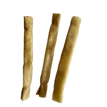Load image into Gallery viewer, Three rolled-up pieces of Nova Buffalo Collagen Stickon a white background
