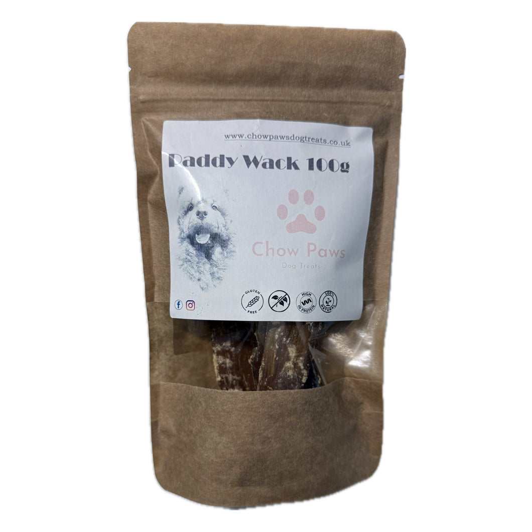 Brown package of 'Daddy Wack' dog treats with a label on a white background